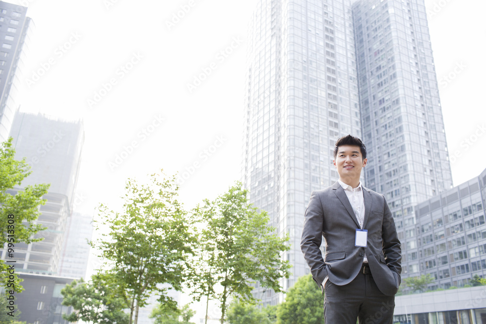 Young businessman looking at view