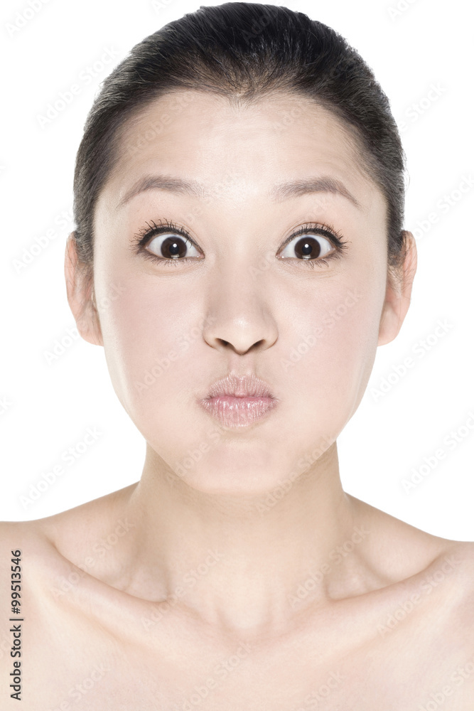 Young woman making a face