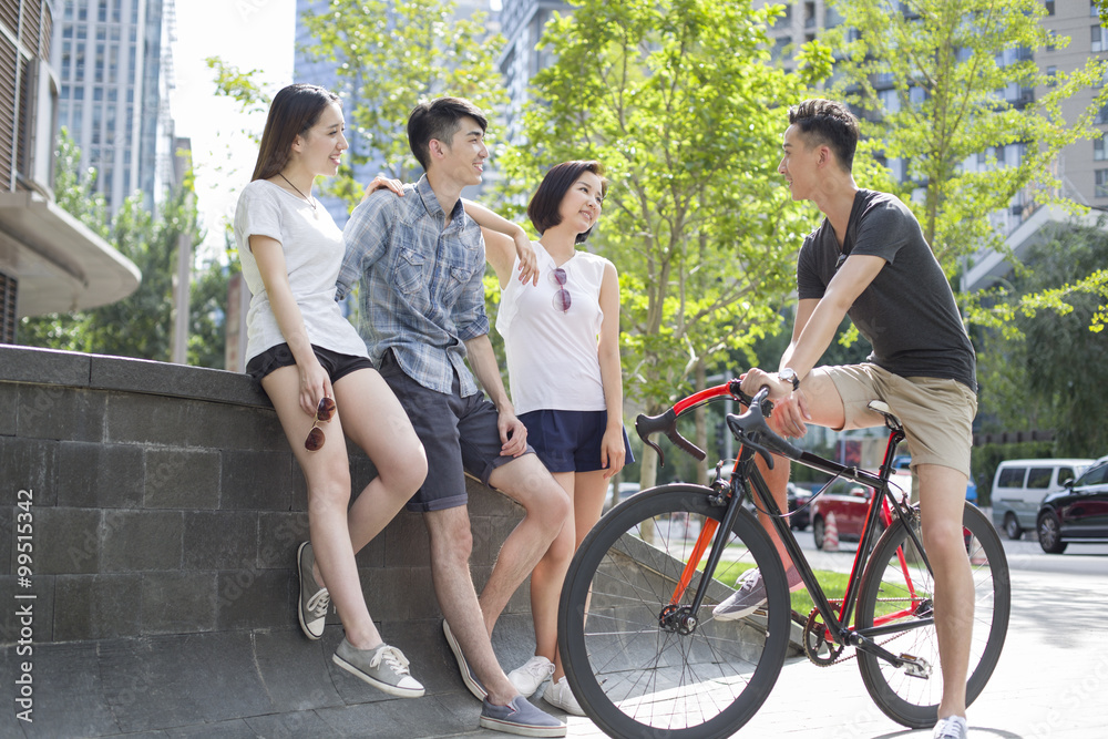 Fototapeta premium Happy young adults talking together
