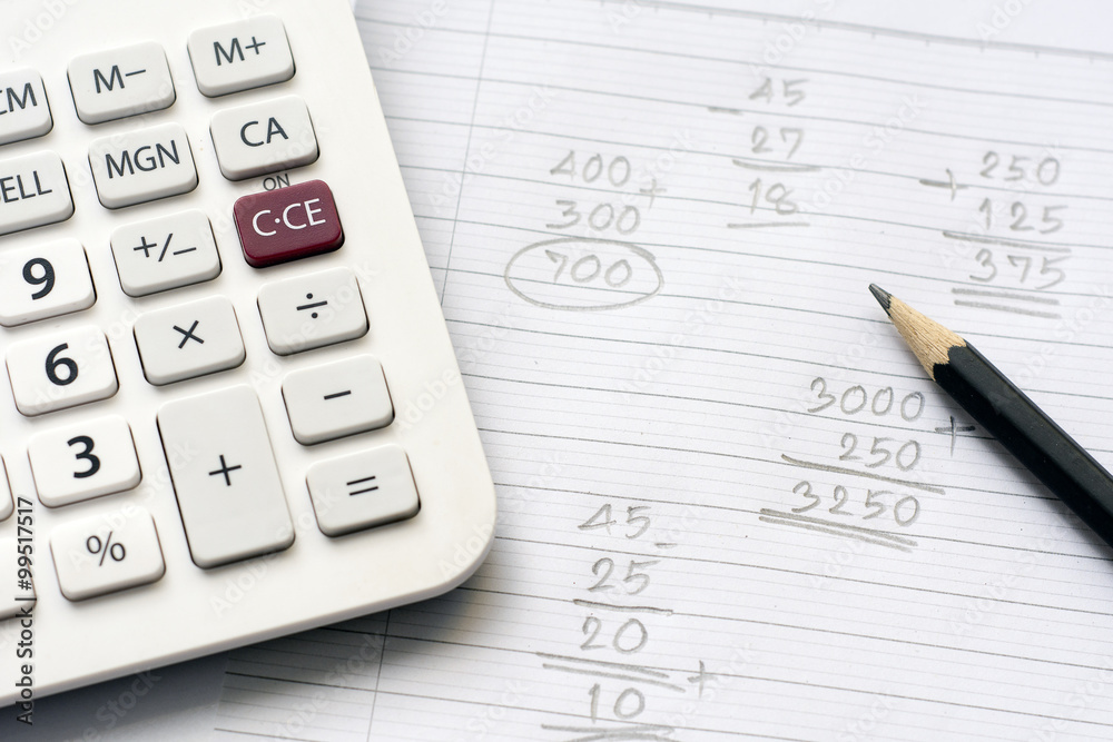 Calculator and pencil on note paper with calculation concept select focus Calculator and pencil on note paper with calculation concept select focus
