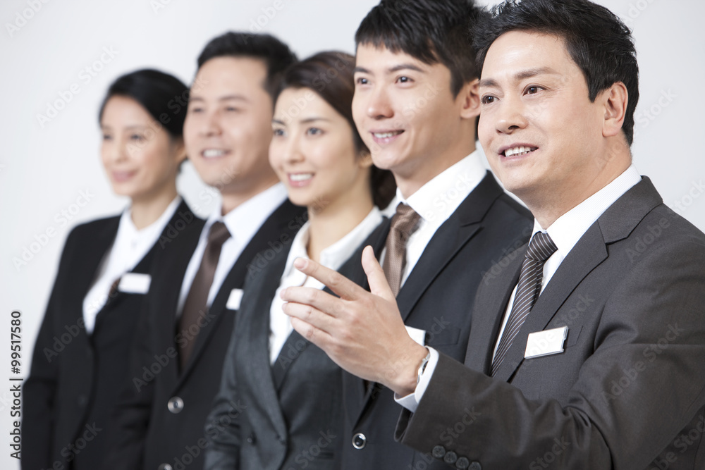 Happy business coworkers looking at view with anticipation Happy business coworkers looking at view with anticipation