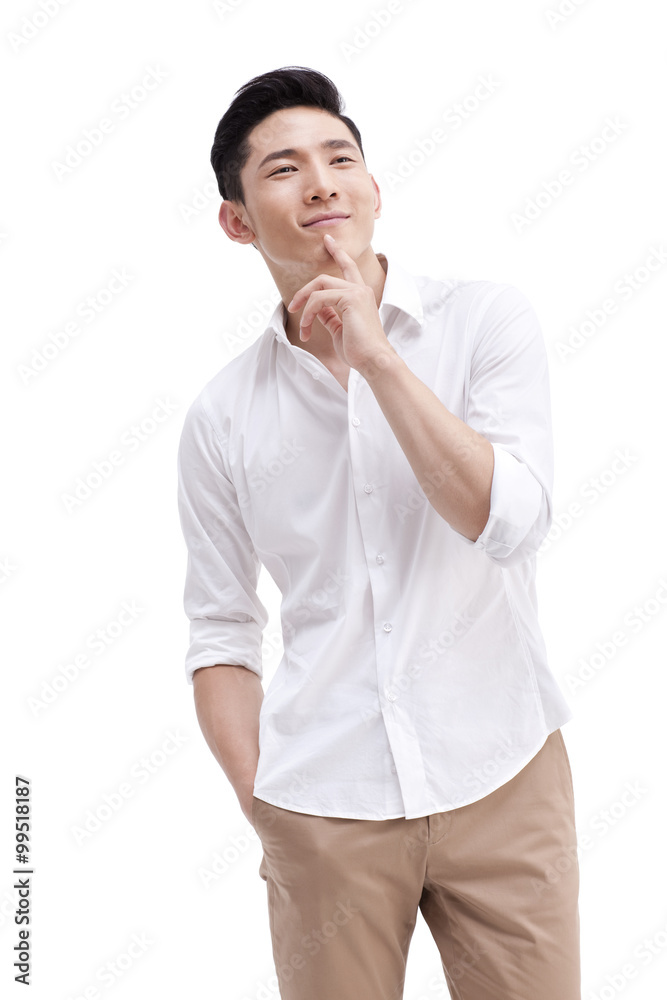 Happy young man with hand on chin Happy young man with hand on chin