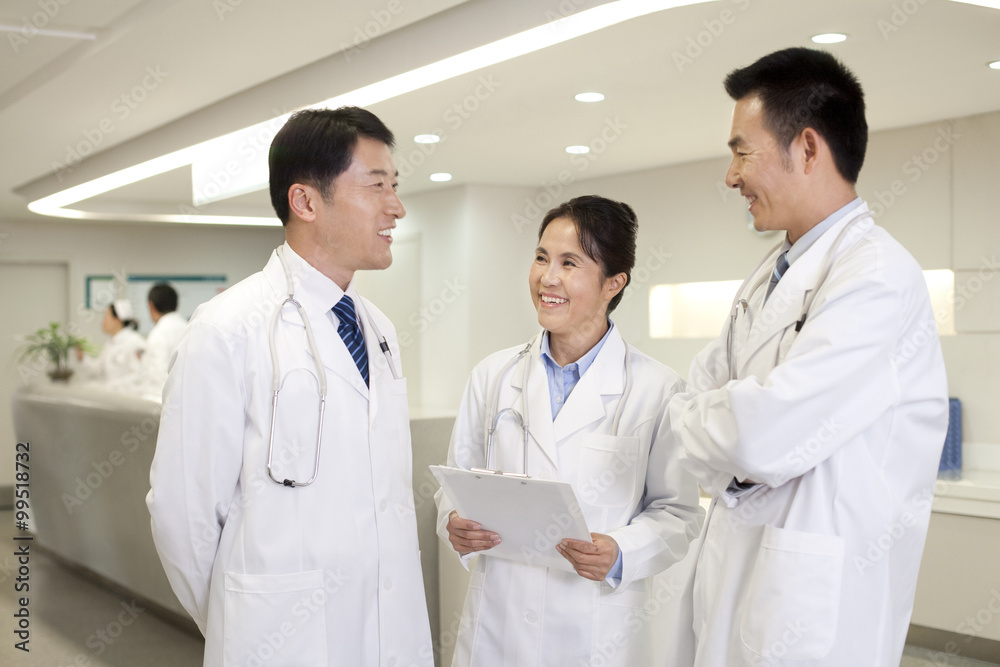 Happy doctors chatting Happy doctors chatting