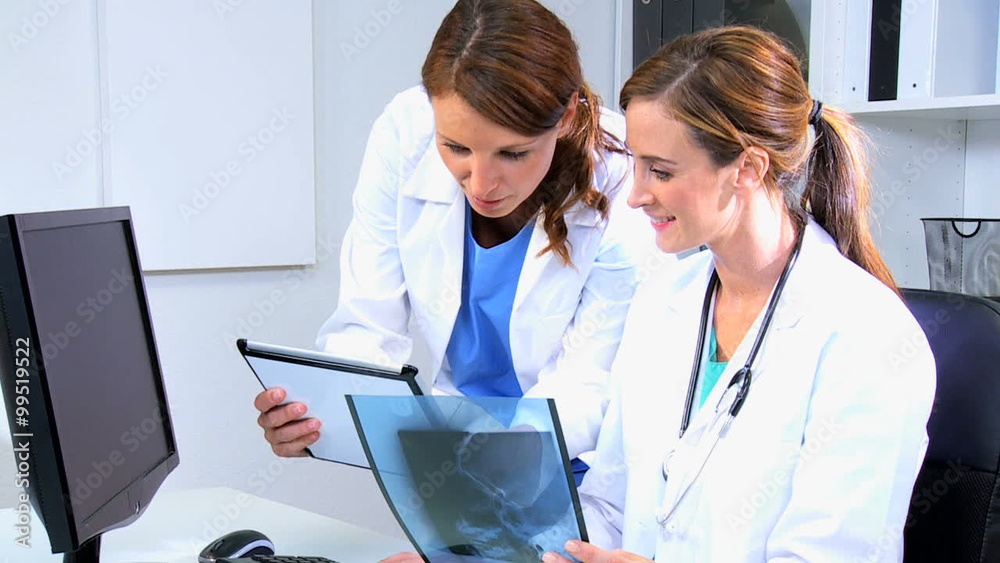 Caucasian female medical consultant computer clinic x-ray diagnosis Caucasian female medical consultant computer clinic x-ray diagnosis