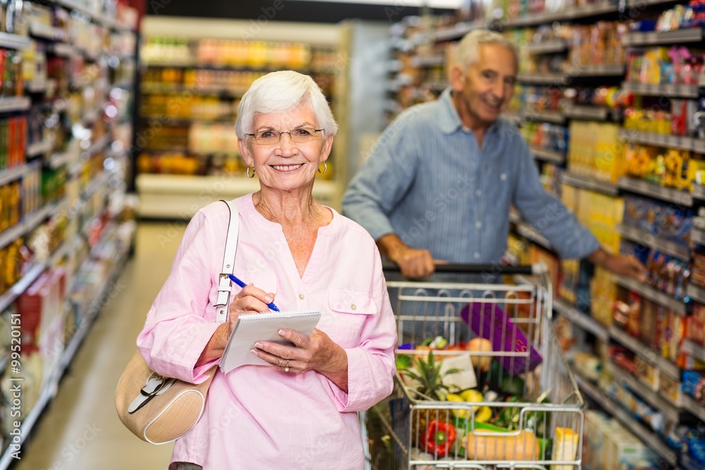 Senior woman with shopping list 