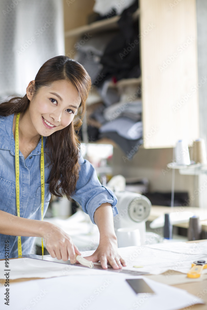 Fashion designer working in studio Fashion designer working in studio