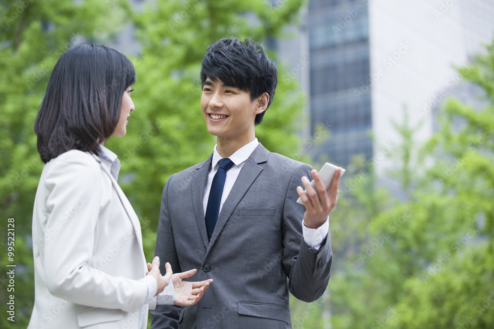 Young businessman and businesswoman discussion Young businessman and businesswoman discussion