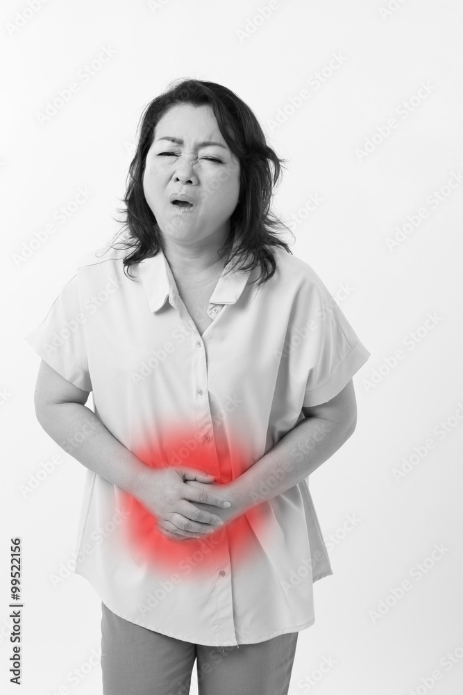 middle aged woman suffering from stomach ache, belly pain, menst middle aged woman suffering from stomach ache, belly pain, menst