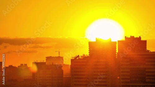 Sunset over downtown city skyline on silhouette of architecture