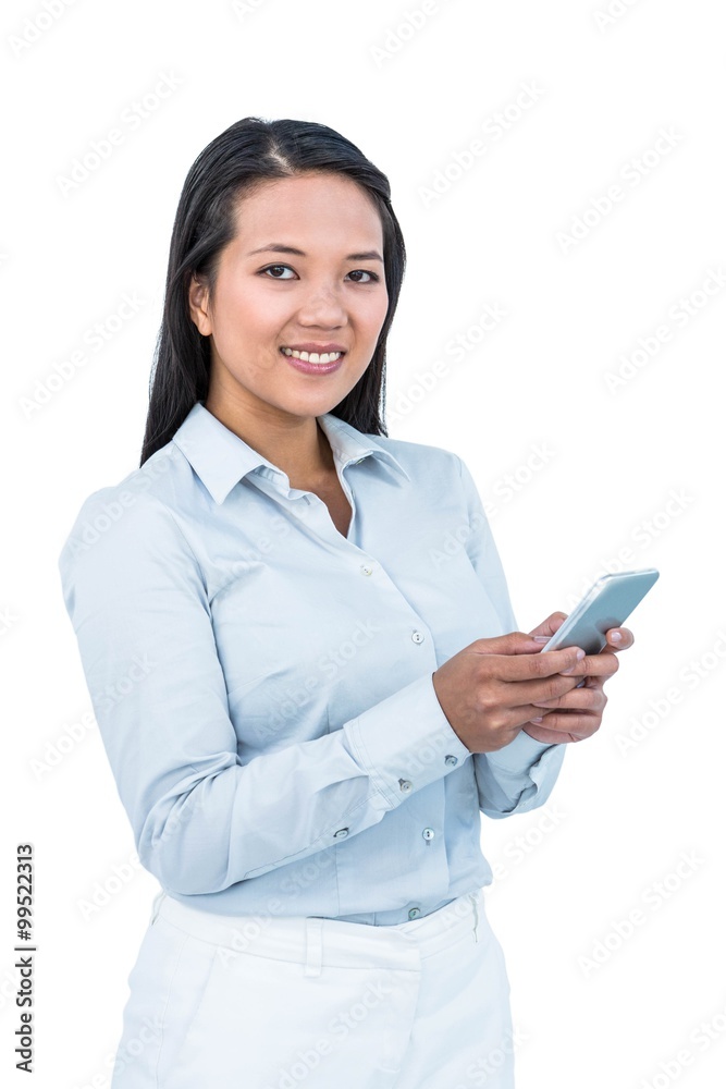 Smiling businesswoman using her smartphone Smiling businesswoman using her smartphone