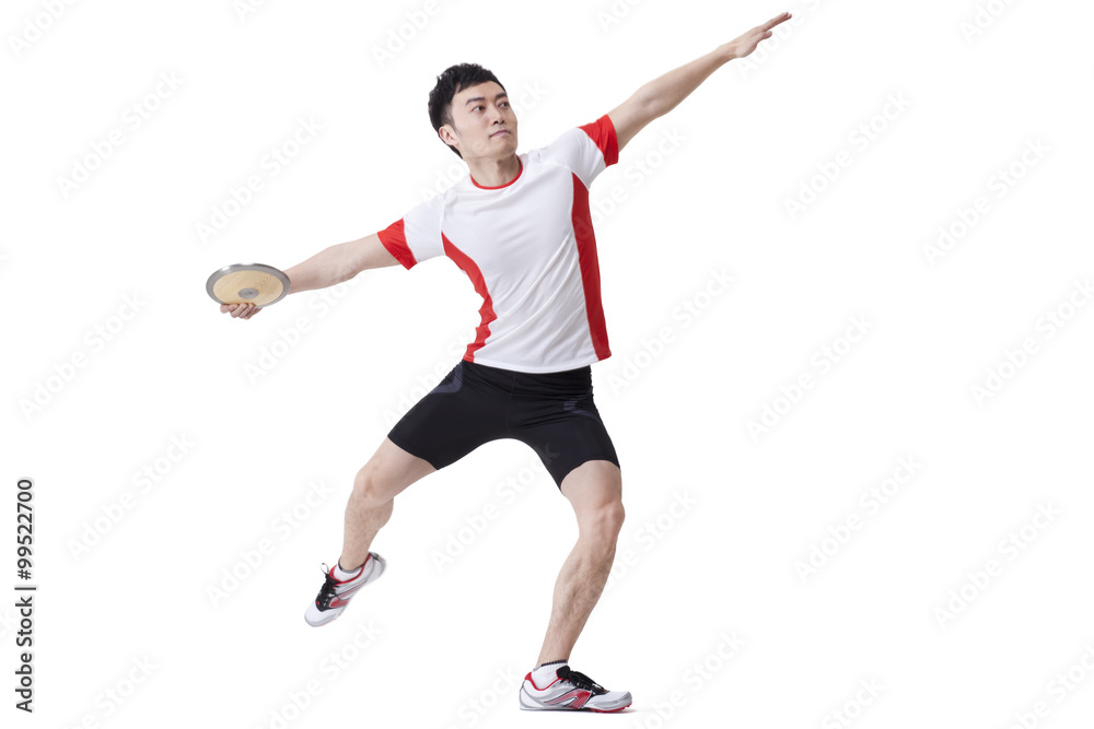 Male athlete throwing discus