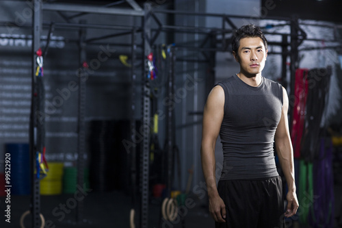 Portrait of young man at gym