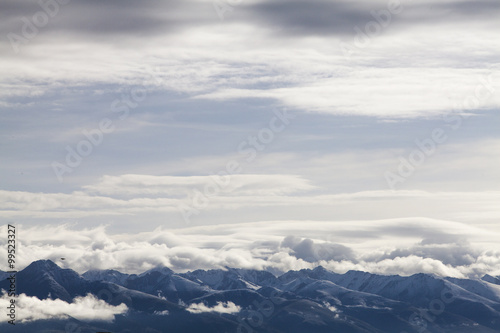 Fototapeta Naklejka Na Ścianę i Meble -  Snow mountains and cloudy sky in Tibet, China