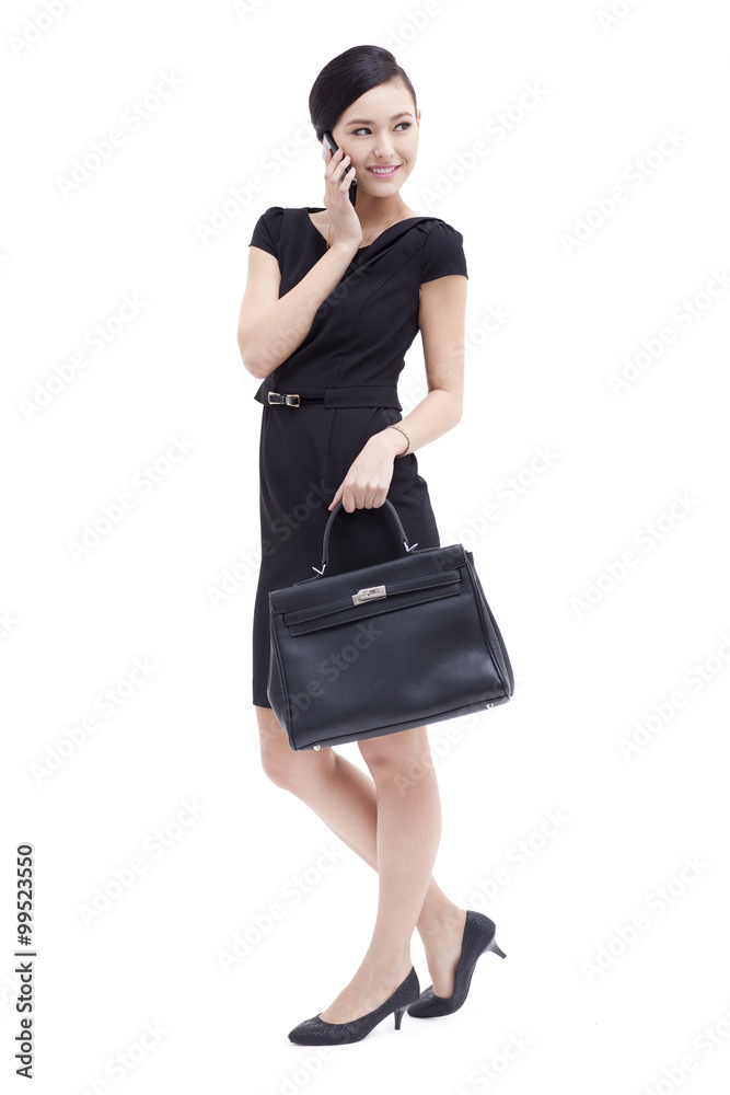 Fashionable businesswoman on the phone Fashionable businesswoman on the phone