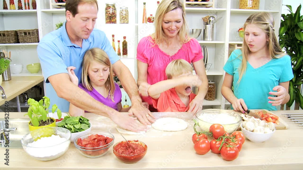 blonde Caucasian family male female cooking homemade healthy organic pizza blonde Caucasian family male female cooking homemade healthy organic pizza
