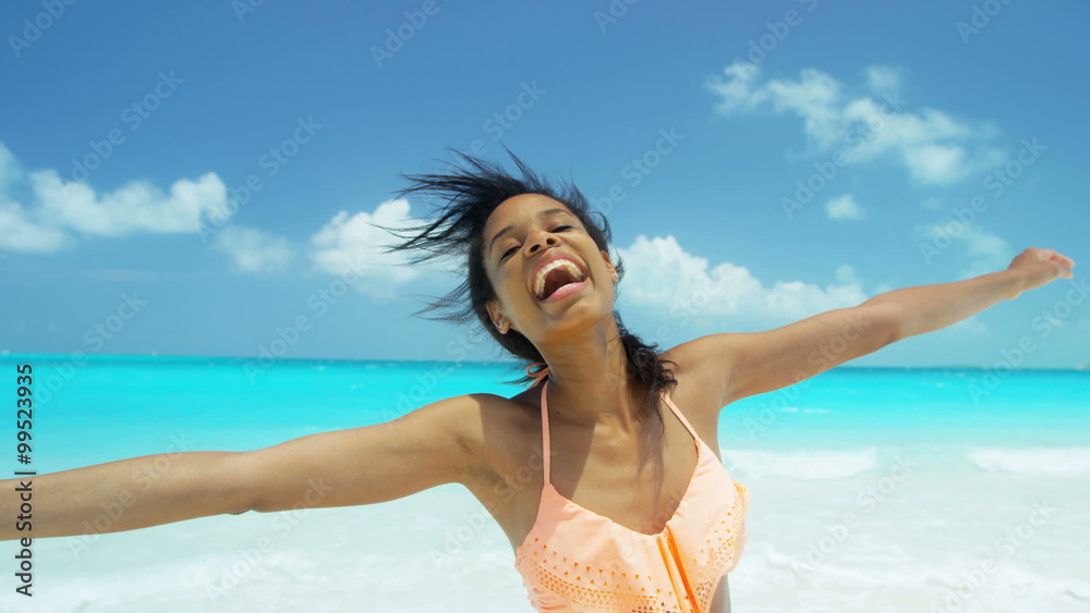 Beautiful African American girl in bikini on tropical beach Beautiful African American girl in bikini on tropical beach