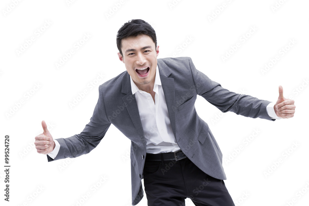 Fashionable businessman doing thumbs up Fashionable businessman doing thumbs up