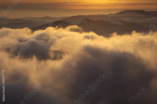 Winter sunset over the clouds - Panoramic view