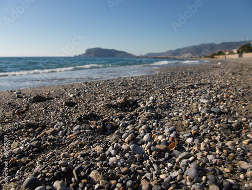 Wave on the beach and beautiful view to ancient fortress on the