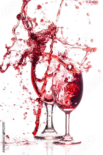 Moving red wine Splash two glass over a white background