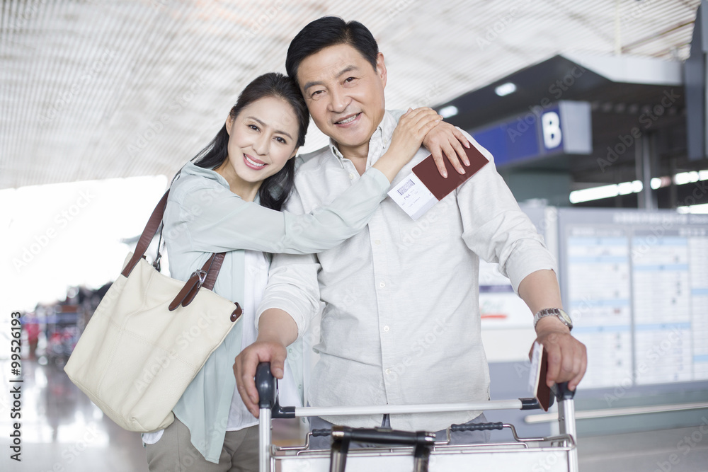 Mature couple waiting at airport Mature couple waiting at airport