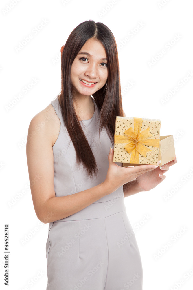 Beautiful young Asian woman with golden gift box Beautiful young Asian woman with golden gift box