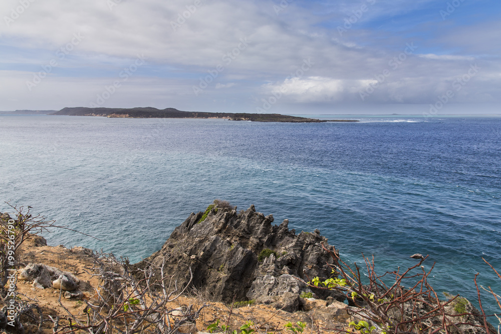Rock cliff on a blue turquoise water landscape