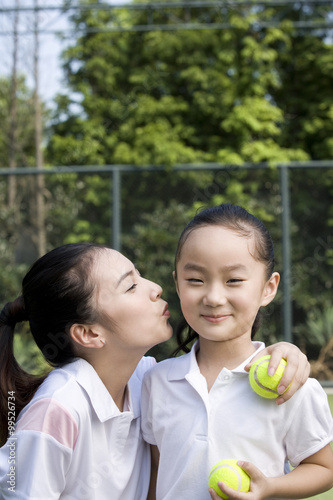 Mother and daughter on the tennis court