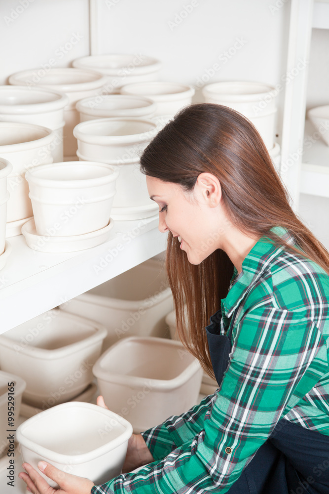 Woman working in a ceramics shop Woman working in a ceramics shop