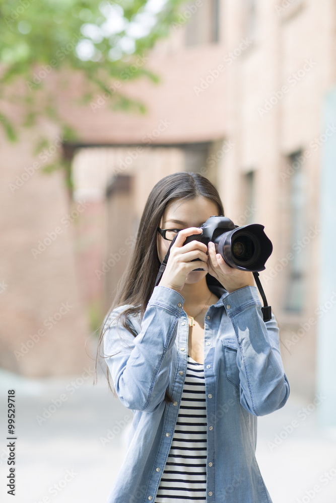 Female photographer taking photos