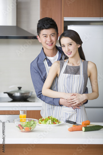 Young couple cooking in the kitchen