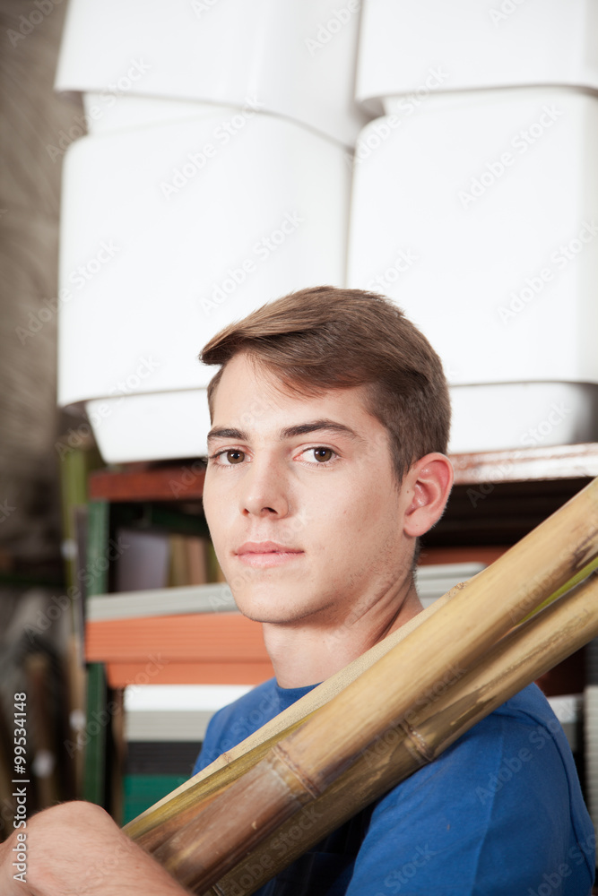 Man holding wooden rods Man holding wooden rods