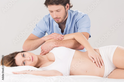 Pregnant woman and physiotherapist