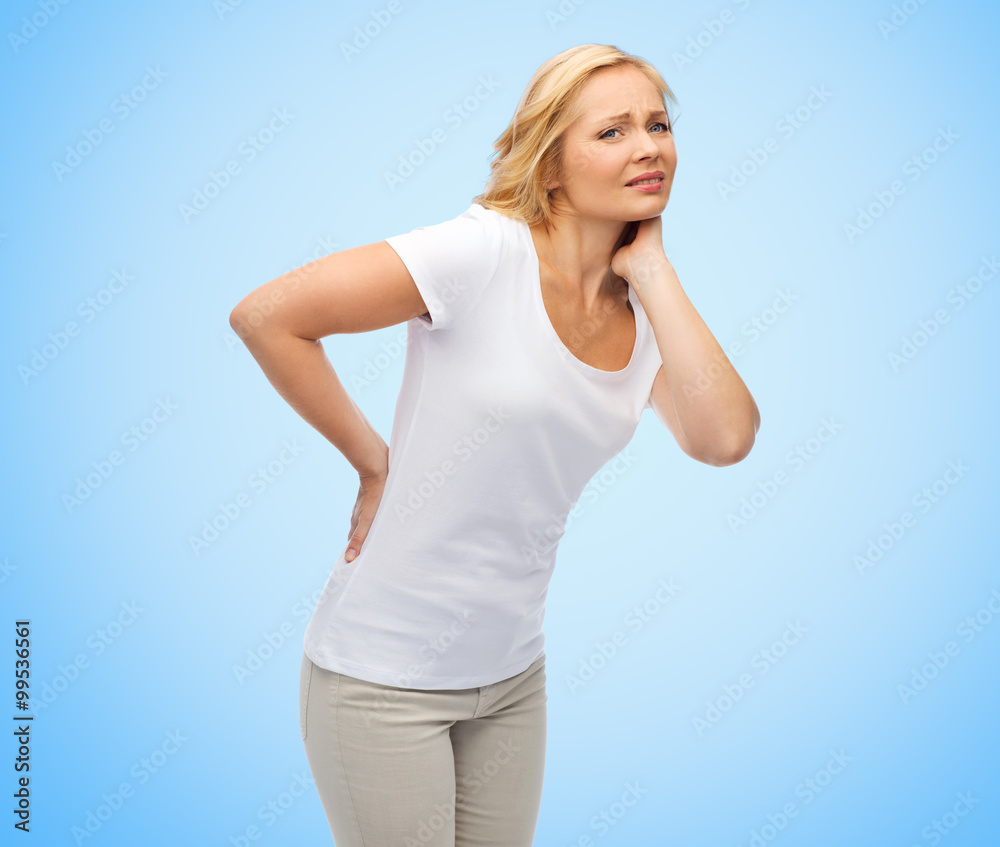 unhappy middle aged woman suffering from backache unhappy middle aged woman suffering from backache