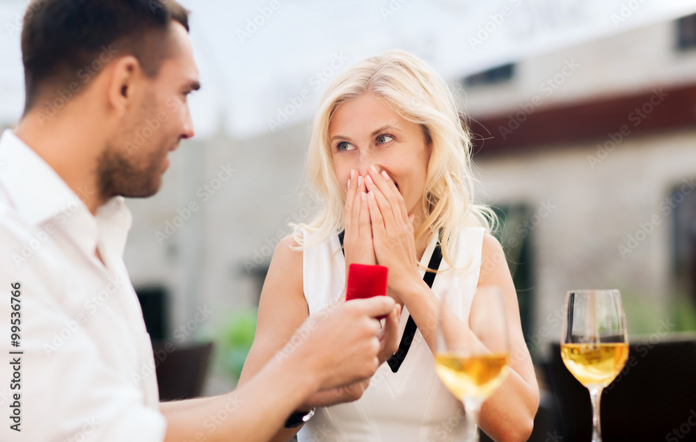 happy couple with engagement ring and wine at cafe happy couple with engagement ring and wine at cafe