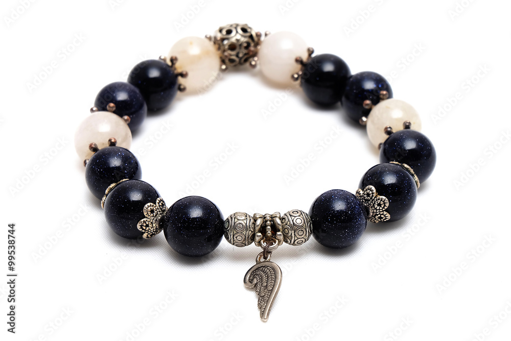 bracelet mix lucky bluesand stone and golden Rutillated Quartz with white isolate background bracelet mix lucky bluesand stone and golden Rutillated Quartz with white isolate background