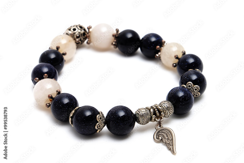 bracelet mix lucky bluesand stone and golden Rutillated Quartz with white isolate background bracelet mix lucky bluesand stone and golden Rutillated Quartz with white isolate background