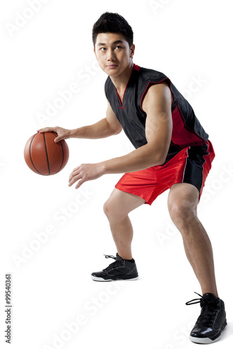 Man dribbling basketball © Blue Jean Images