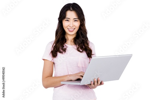 Portrait of happy woman holding laptop © WavebreakmediaMicro