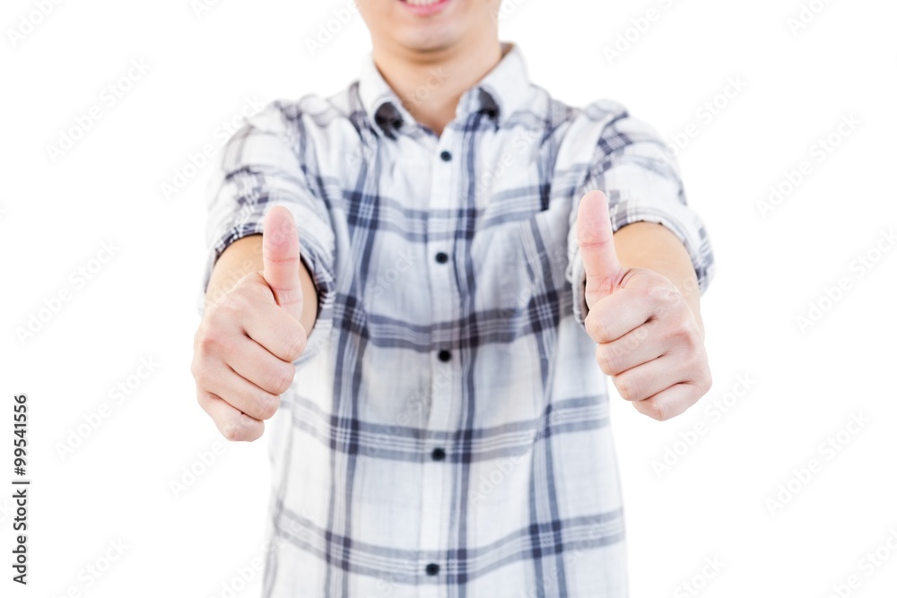 Midsection of man showing thumbs up Midsection of man showing thumbs up