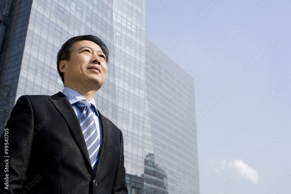 Older businessman looking into the distance Older businessman looking into the distance