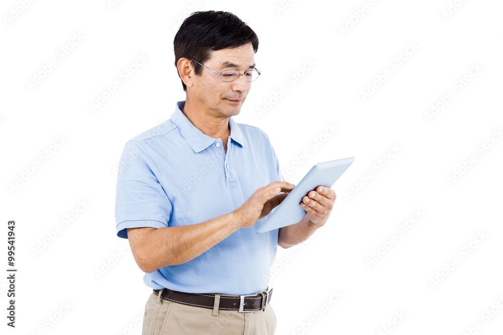 Confident man using digital tablet while standing Confident man using digital tablet while standing
