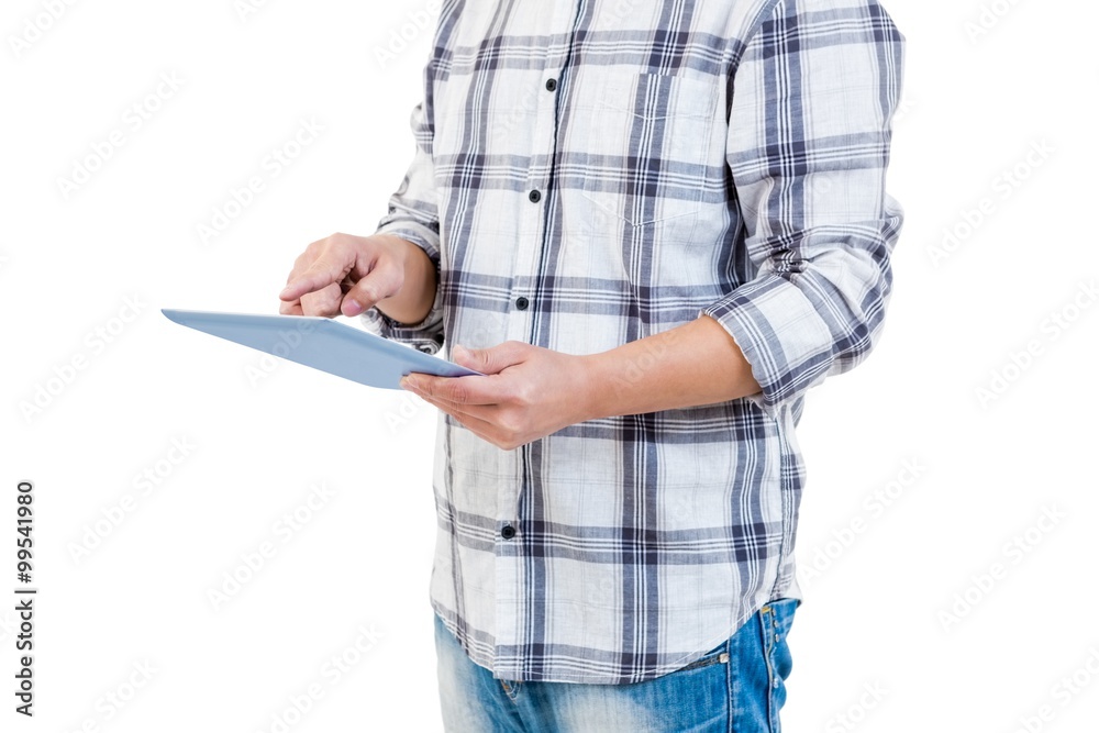 Mid section of man using tablet computer Mid section of man using tablet computer