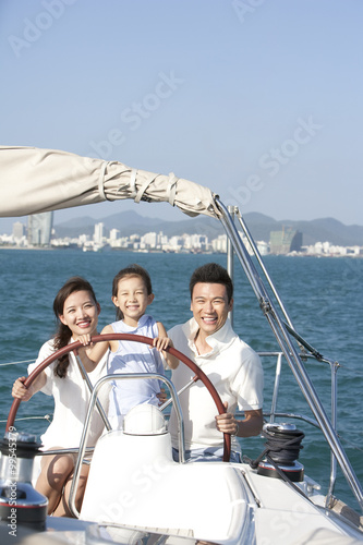 Happy family sailing