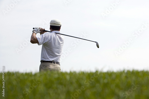 Rear View of Golfer's Swing