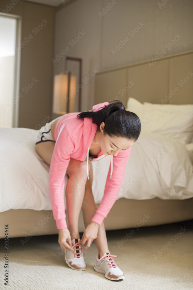 Young woman preparing for running Young woman preparing for running