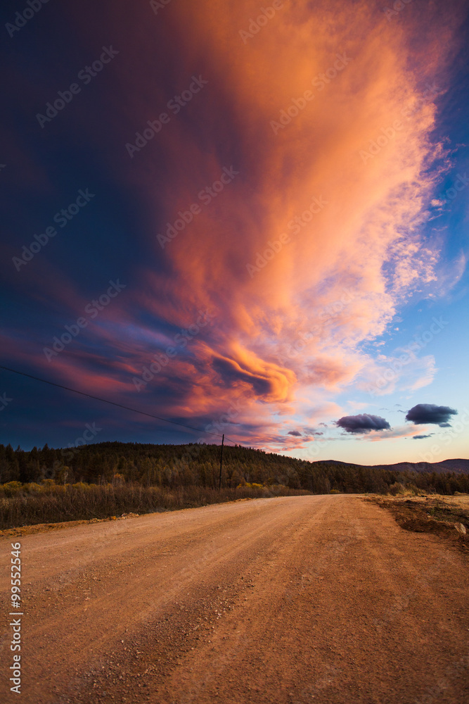 Burning clouds and dirt road in Aershan,China 