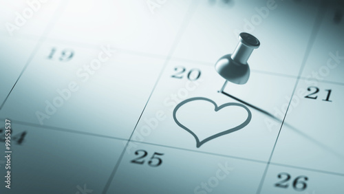 Concept image of a Calendar with a push pin. Closeup shot of a t