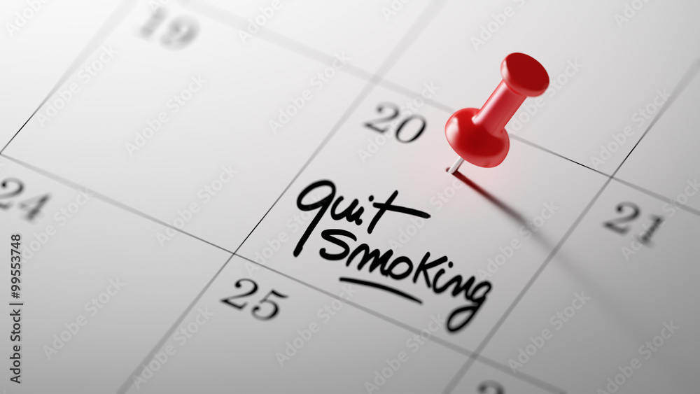 Concept image of a Calendar with a red push pin. Closeup shot of