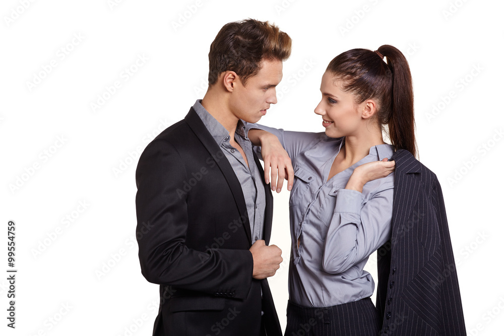 Successful business couple is standing on isolated background. Successful business couple is standing on isolated background.